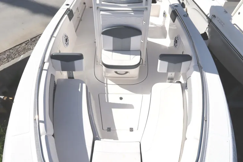 Slide: The Image of 2021 Robalo R242 Explorer boat interior with white seating and modern design. - 31