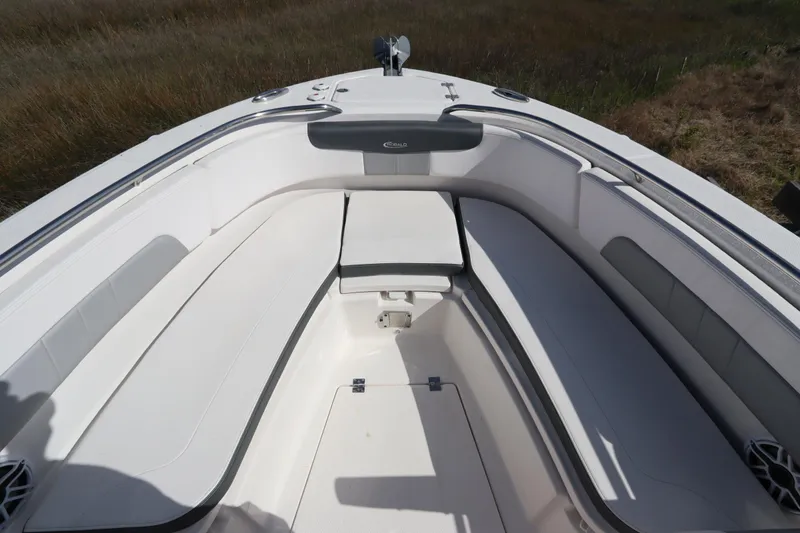 Slide: The Image of 2021 Robalo R242 Explorer boat interior with spacious seating and storage compartments. - 32