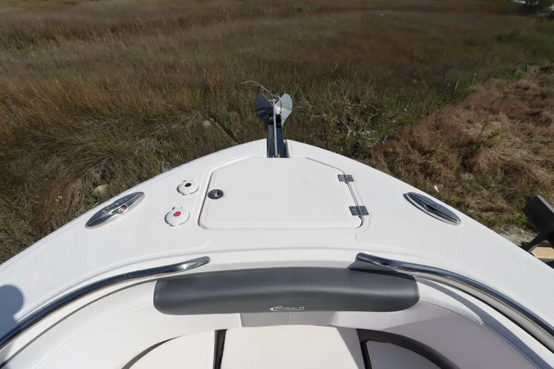 Slide: The Image of Bow of 2021 Robalo R242 Explorer boat with anchor and storage hatch. - 35