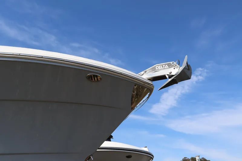 Slide: The Image of 2021 Robalo R242 Explorer boat bow against blue sky background. - 4