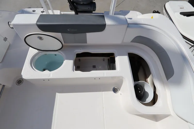 Slide: The Image of 2021 Robalo R242 Explorer boat interior with storage compartments and seating area. - 41