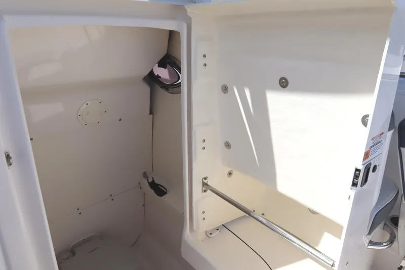 Slide: The Image of Interior of 2021 Robalo R242 Explorer boat, featuring storage compartment and sleek design. - 46