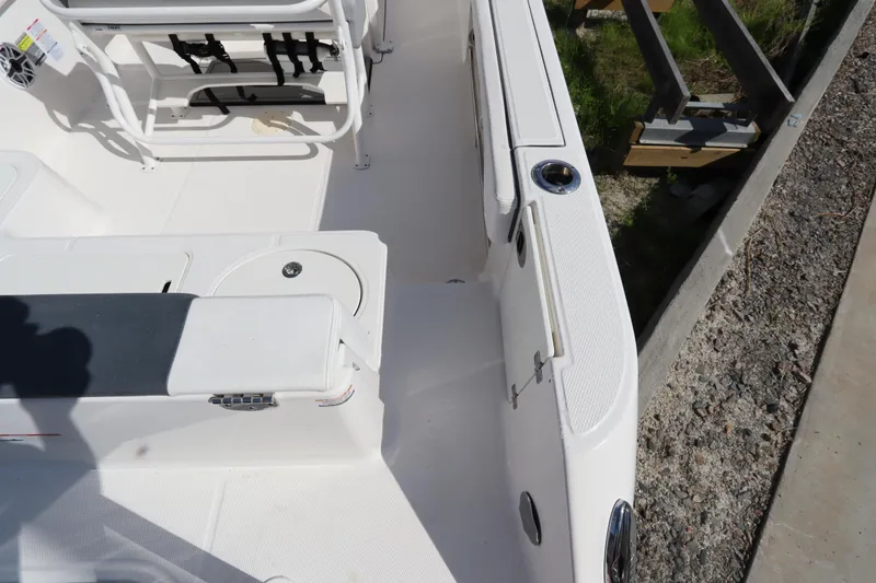 Slide: The Image of 2021 Robalo R242 Explorer boat deck with seating and storage compartments. - 48