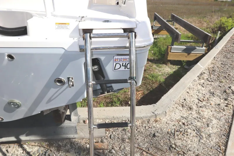 Slide: The Image of 2021 Robalo R242 Explorer boat with a stainless steel swim ladder. - 49