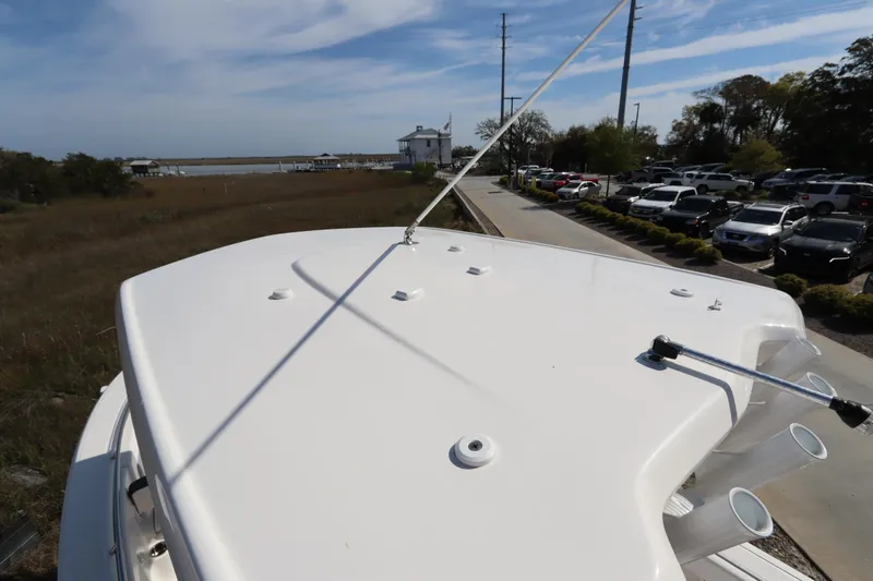 Slide: The Image of 2021 Robalo R242 Explorer boat deck with scenic waterfront view. - 8