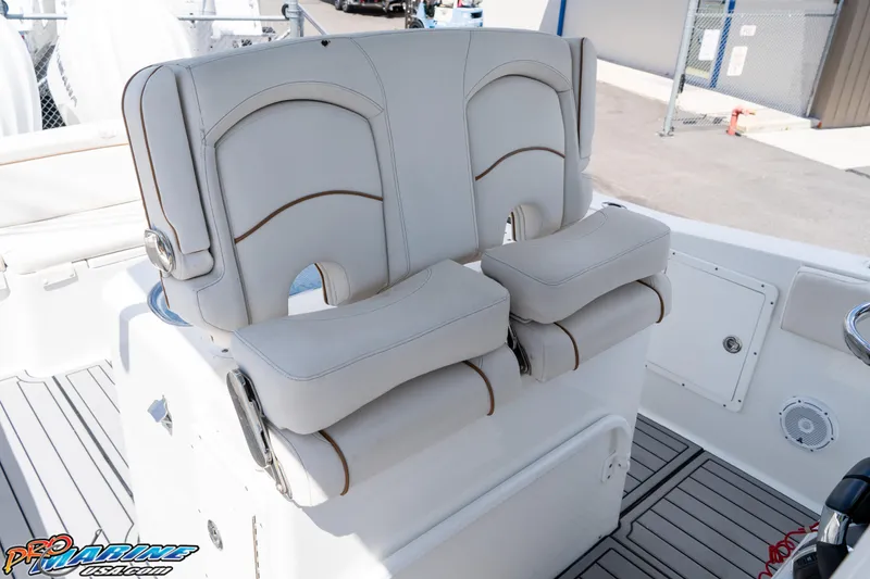 Slide: The Image of 2021 Sea Hunt ULTRA 305 boat seating, featuring comfortable, cushioned dual seats in a sleek design. - 15