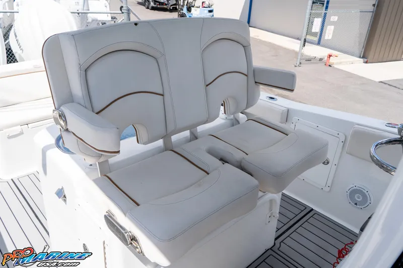 Slide: The Image of 2021 Sea Hunt ULTRA 305 boat seats with armrests, featuring sleek design and comfortable upholstery. - 16