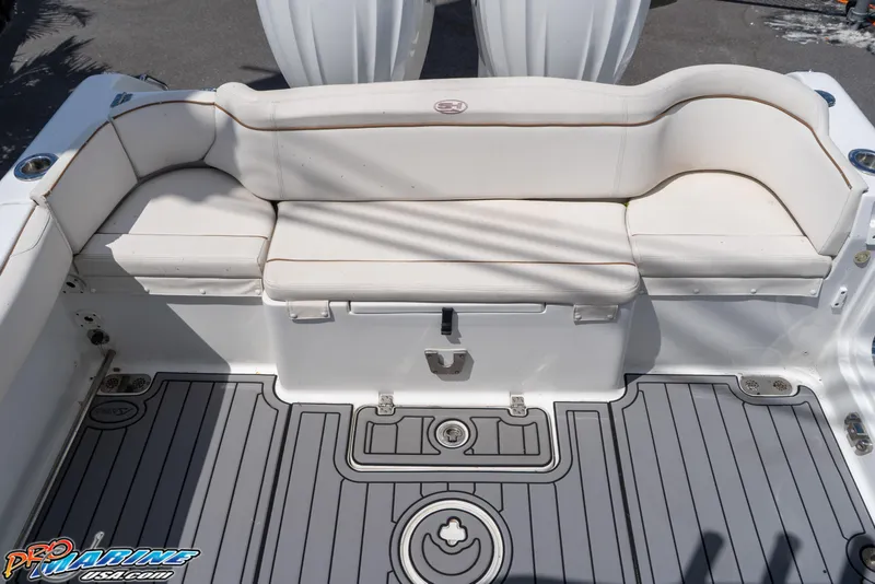 Slide: The Image of 2021 Sea Hunt ULTRA 305 boat with cushioned seating and sleek deck design. - 17