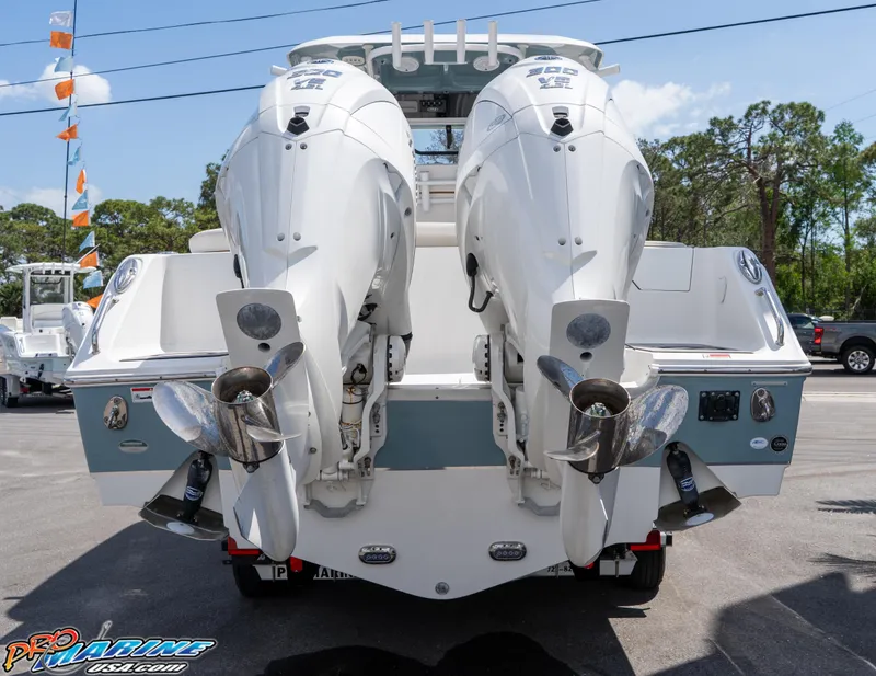 Slide: The Image of 2021 Sea Hunt ULTRA 305 boat with dual outboard engines, rear view. - 4