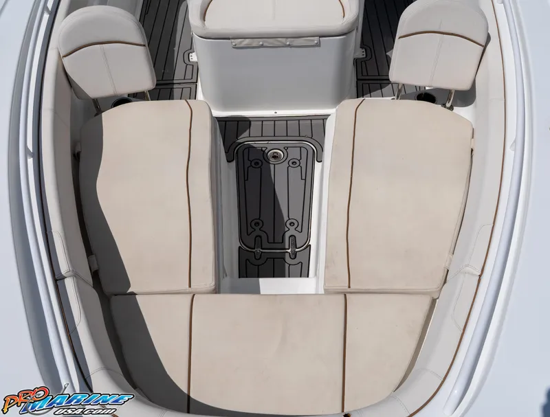 Slide: The Image of 2021 Sea Hunt ULTRA 305 boat interior with beige seating and gray flooring. - 7