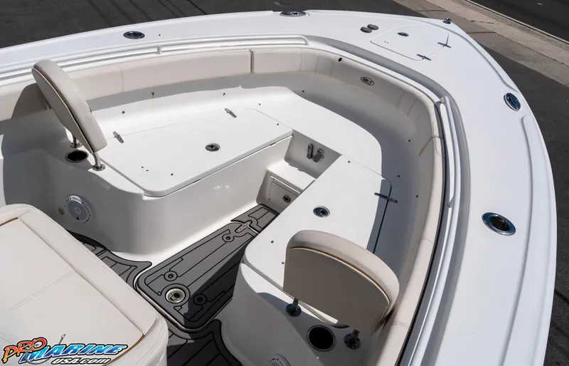 Slide: The Image of 2021 Sea Hunt ULTRA 305 boat interior with seating and storage compartments. - 9
