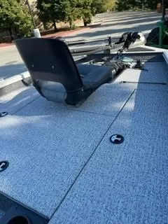 Slide: The Image of 2025 Tracker Pro Team 175 boat deck with seating and fishing equipment. - 3