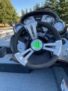 Slide: The Image of 2025 Tracker Pro Team 175 boat dashboard with steering wheel and gauges. - 7