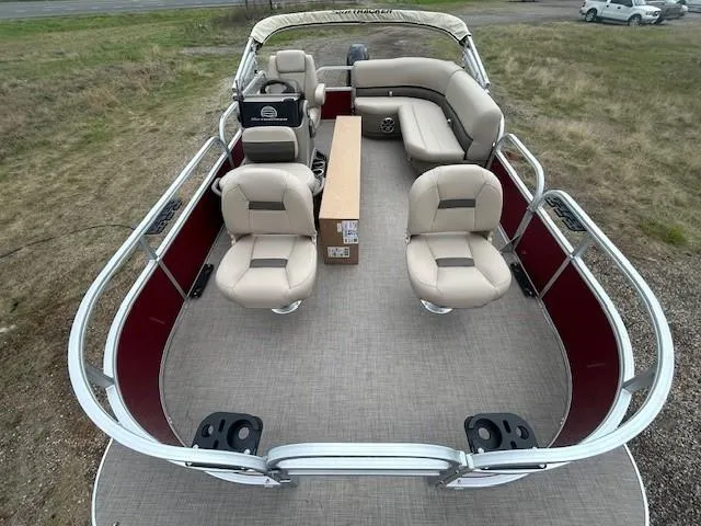 Slide: The Image of 2025 Sun Tracker Bass Buggy 16 XL Select pontoon boat with beige seating and spacious layout. - 11