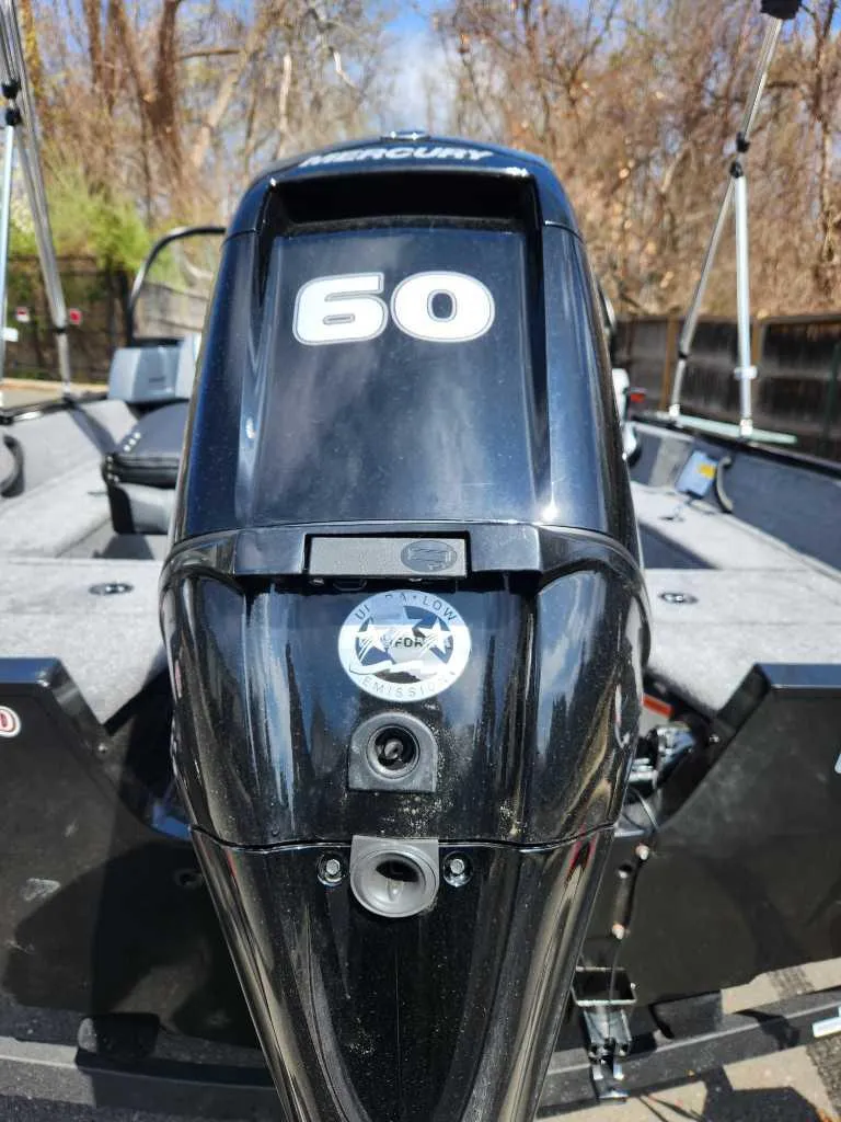 Slide: The Image of 2025 Tracker Pro Guide V-16 WT boat with a 60 HP Mercury outboard motor. - 5