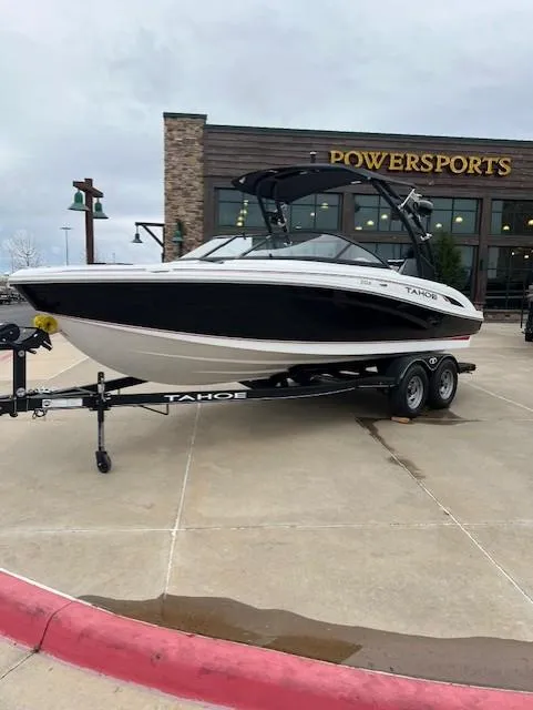 Slide: The Image of 2024 Tahoe 210 S boat on trailer outside Powersports store. - 2