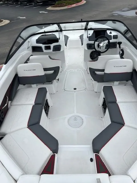 Slide: The Image of 2024 Tahoe 210 S boat interior with seating and steering wheel, showcasing modern design. - 5