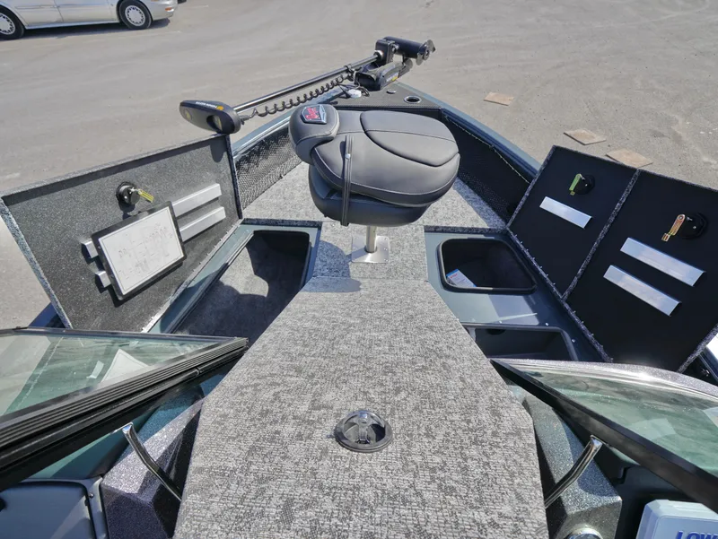 Slide: The Image of 2025 Ranger VS1782SC Reata boat interior with seating and storage compartments. - 11