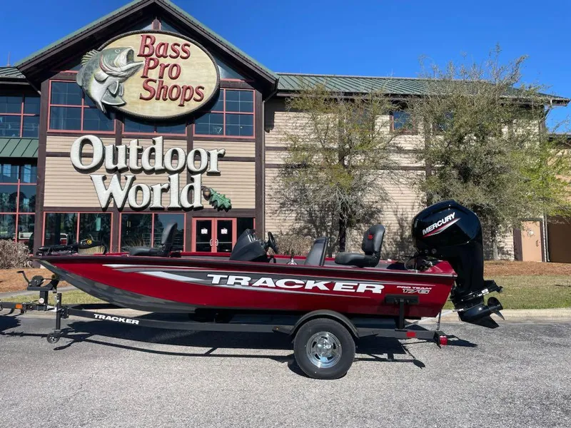 Slide: The Image of 2025 Tracker Pro Team 175 boat outside Bass Pro Shops Outdoor World. - 2