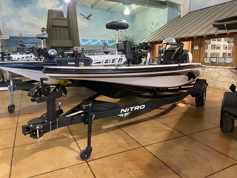 The Image of 2025 Nitro Z18 Pro fishing boat displayed indoors on a trailer. - 0