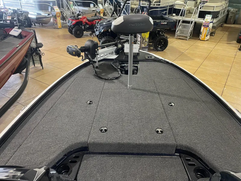 Slide: The Image of 2025 Nitro Z18 Pro boat interior with gray carpet and seating in showroom. - 11