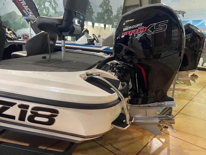 Slide: The Image of 2025 Nitro Z18 Pro boat with Mercury Pro XS engine displayed indoors. - 2