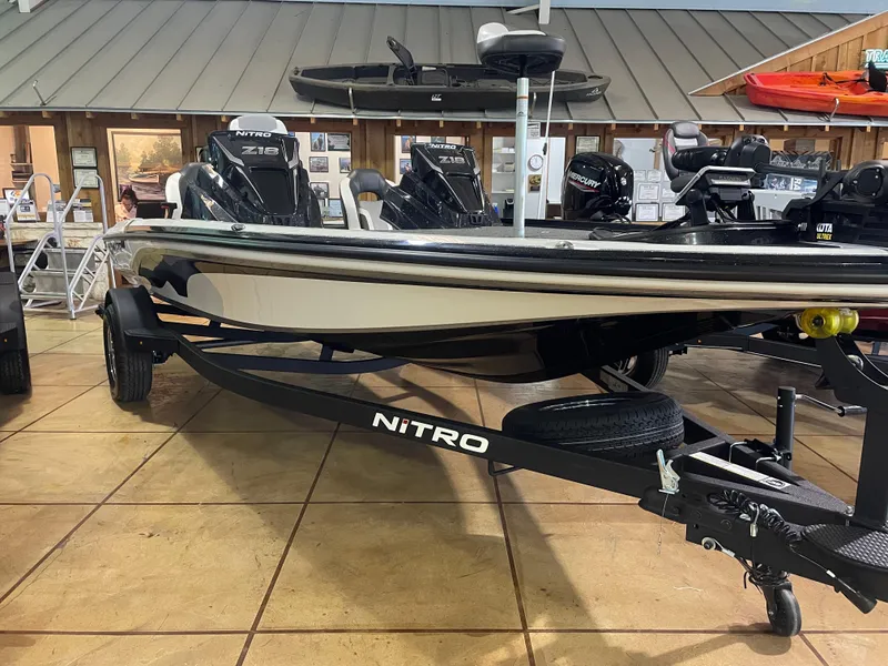 Slide: The Image of 2025 Nitro Z18 Pro boat displayed in showroom with trailer. - 5