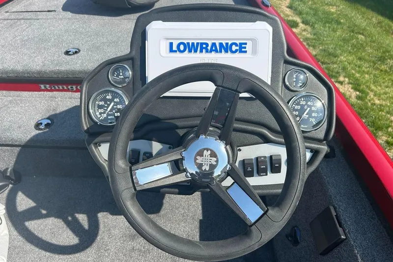 Slide: The Image of Steering wheel and dashboard of 2025 Ranger RT178 boat with Lowrance display. - 2
