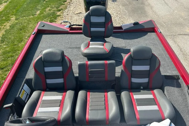Slide: The Image of 2025 Ranger RT178 boat interior with gray and red seating arrangement. - 4