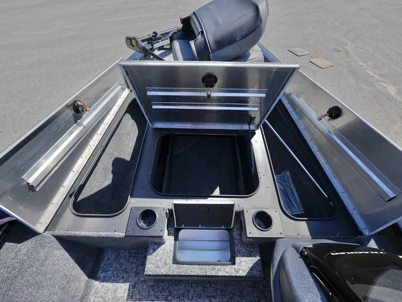 Slide: The Image of 2025 Tracker Pro Team 175 boat with open storage compartments and seating. - 10