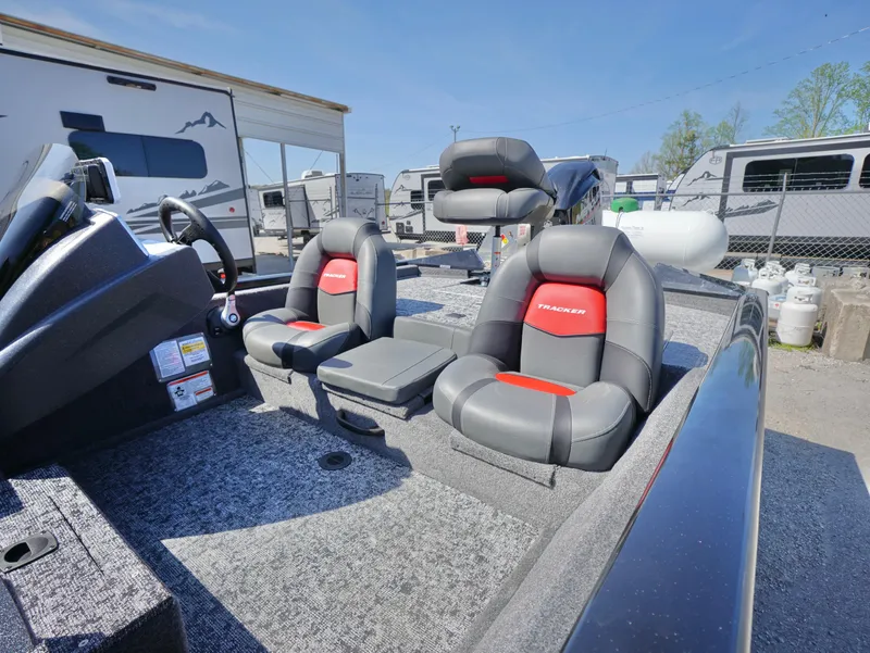 Slide: The Image of 2025 Tracker Pro Team 175 boat interior with modern seating and dashboard. - 13
