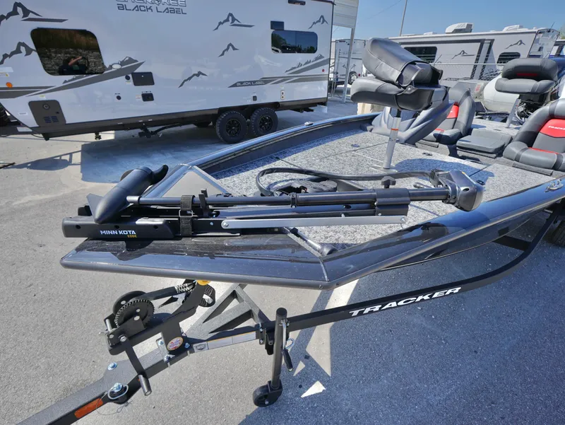 Slide: The Image of 2025 Tracker Pro Team 175 boat with trailer, featuring a Minn Kota trolling motor. - 14