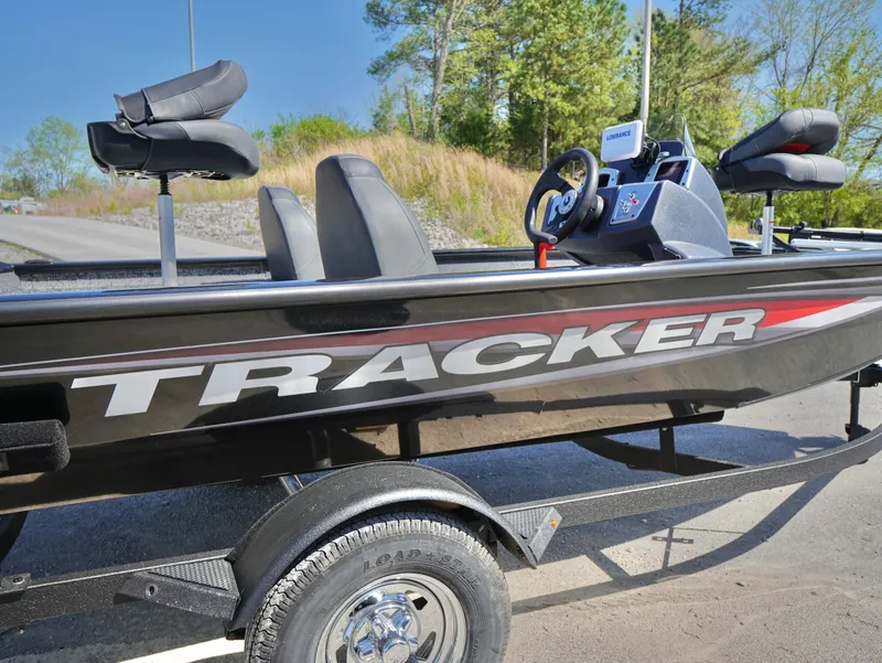 Slide: The Image of 2025 Tracker Pro Team 175 boat on trailer, side view, outdoors. - 17
