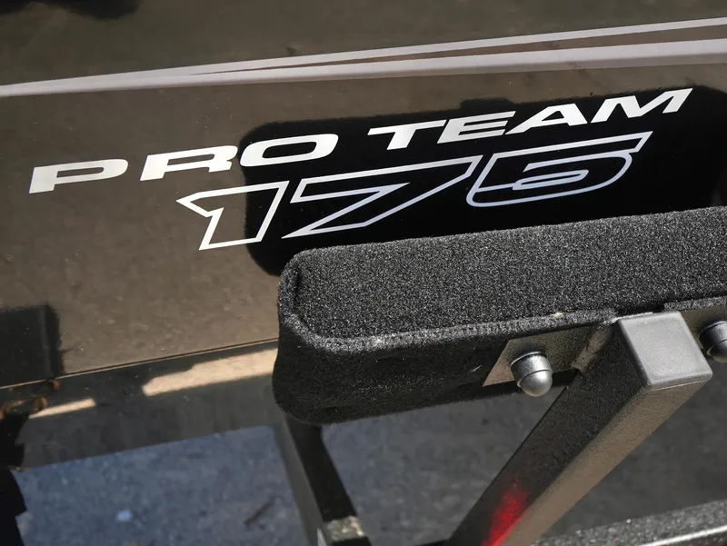 Slide: The Image of 2025 Tracker Pro Team 175 boat logo on black surface. - 18