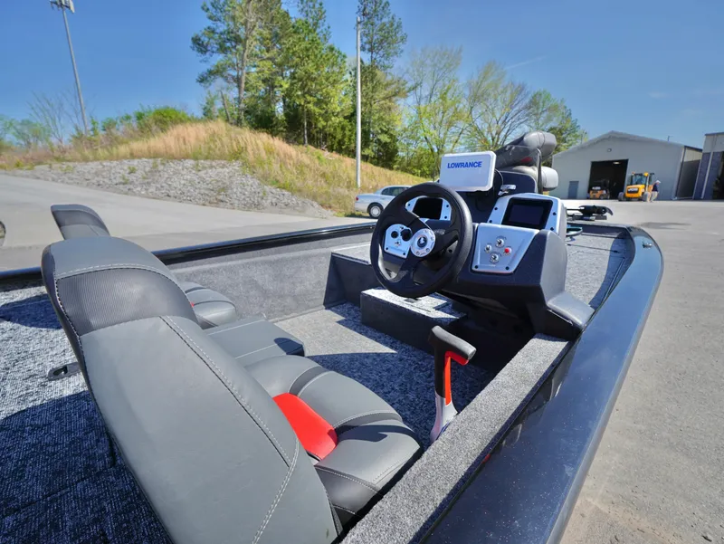 Slide: The Image of 2025 Tracker Pro Team 175 boat interior with steering wheel and navigation system. - 6