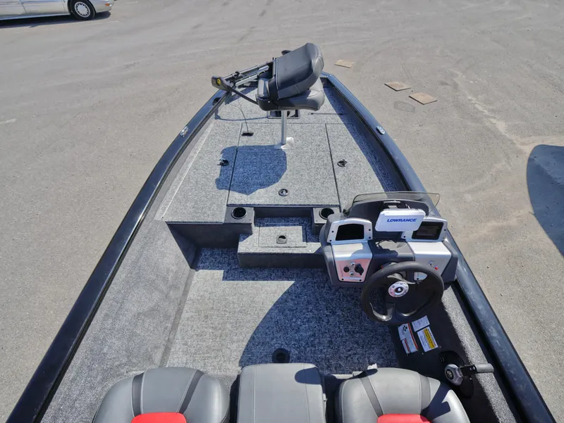 Slide: The Image of 2025 Tracker Pro Team 175 boat interior with steering console and seating. - 9