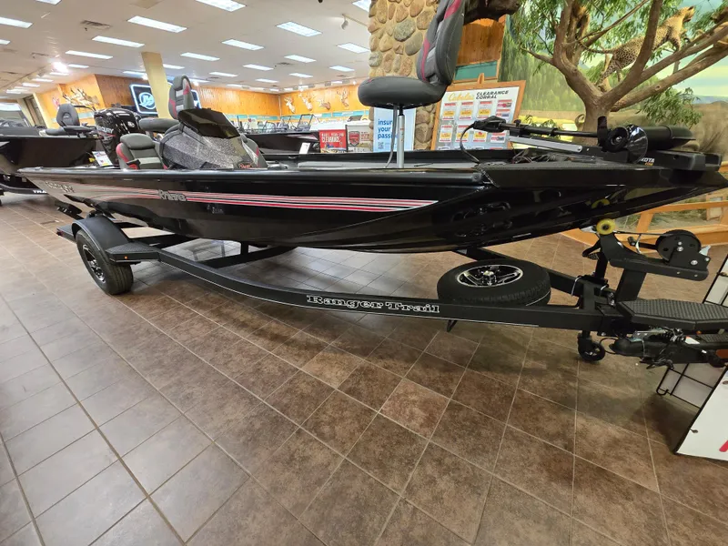 Slide: The Image of 2025 Ranger RT178 boat displayed indoors on a showroom floor. - 1