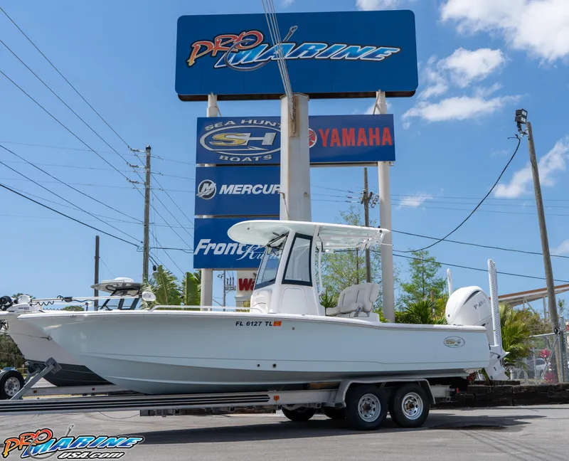 Slide: The Image of 2022 Sea Hunt BX 25 FS boat on trailer at Pro Marine dealership. - 1