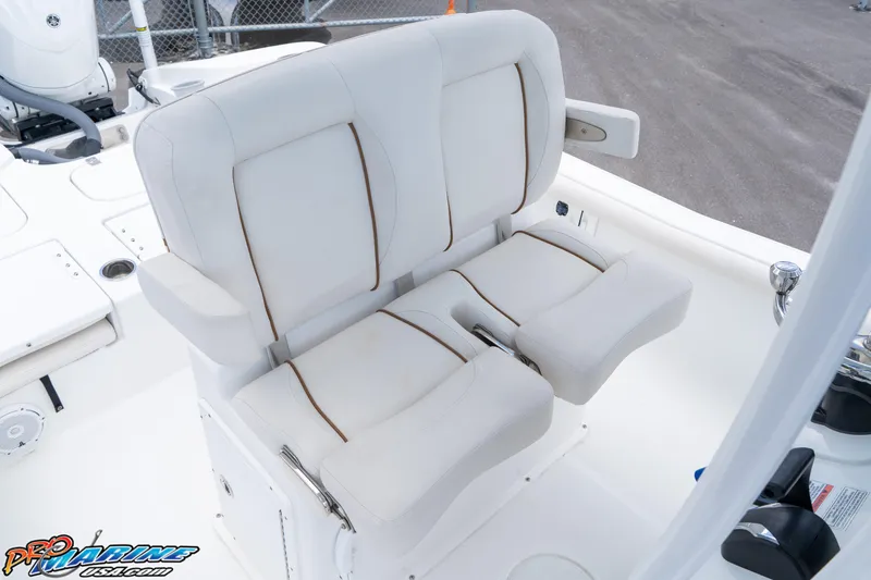 Slide: The Image of 2022 Sea Hunt BX 25 FS boat with white cushioned seating. - 13