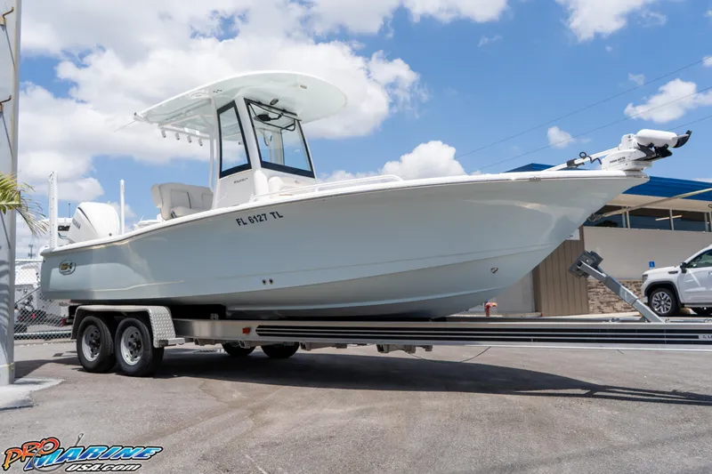 Slide: The Image of 2022 Sea Hunt BX 25 FS boat on trailer under blue sky. - 3