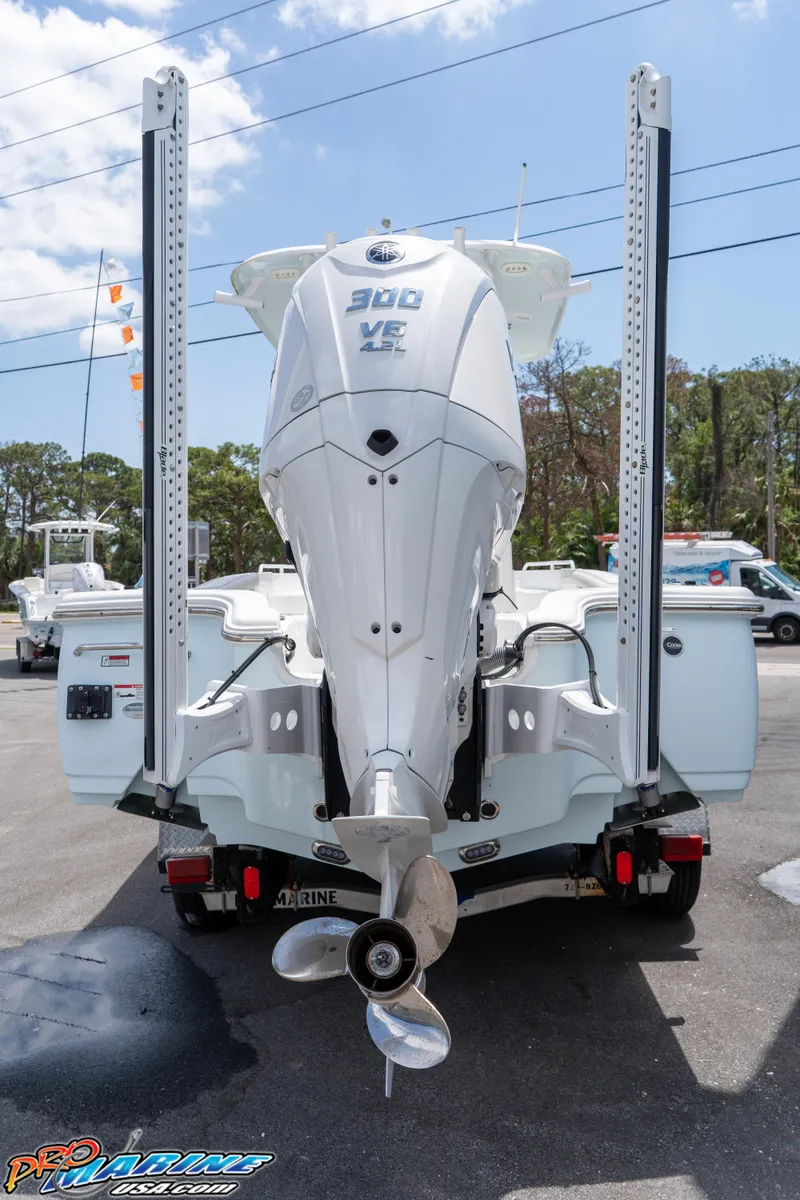 Slide: The Image of 2022 Sea Hunt BX 25 FS boat with powerful outboard motor, displayed outdoors. - 5
