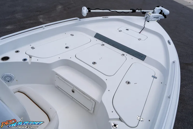 Slide: The Image of 2022 Sea Hunt BX 25 FS boat deck with storage compartments and trolling motor. - 9