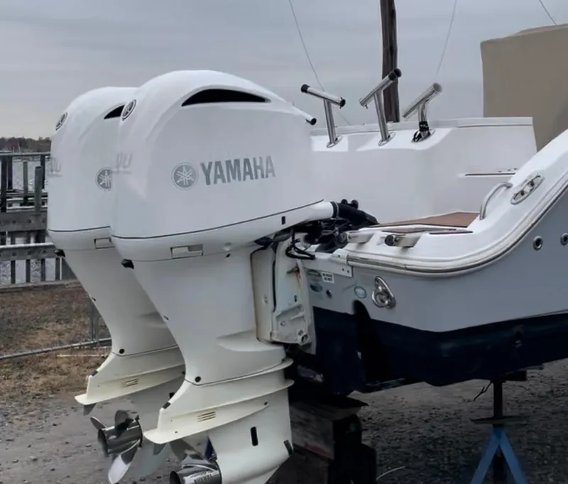 Slide: The Image of 2017 Sea Fox 288 Commander with twin Yamaha outboard engines, docked on a cloudy day. - 11