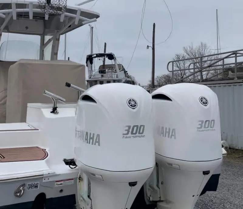 Slide: The Image of 2017 Sea Fox 288 Commander with twin Yamaha 300 engines at a marina. - 12