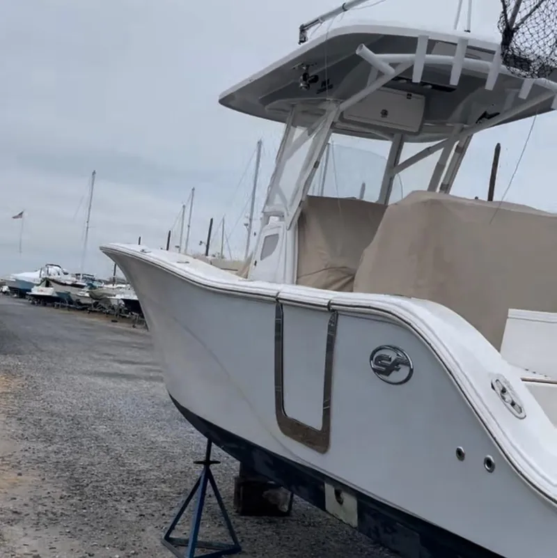Slide: The Image of 2017 Sea Fox 288 Commander boat on a stand at a marina. - 13