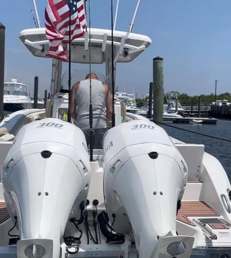 Slide: The Image of 2017 Sea Fox 288 Commander with twin Yamaha 300 engines docked at a marina. - 14