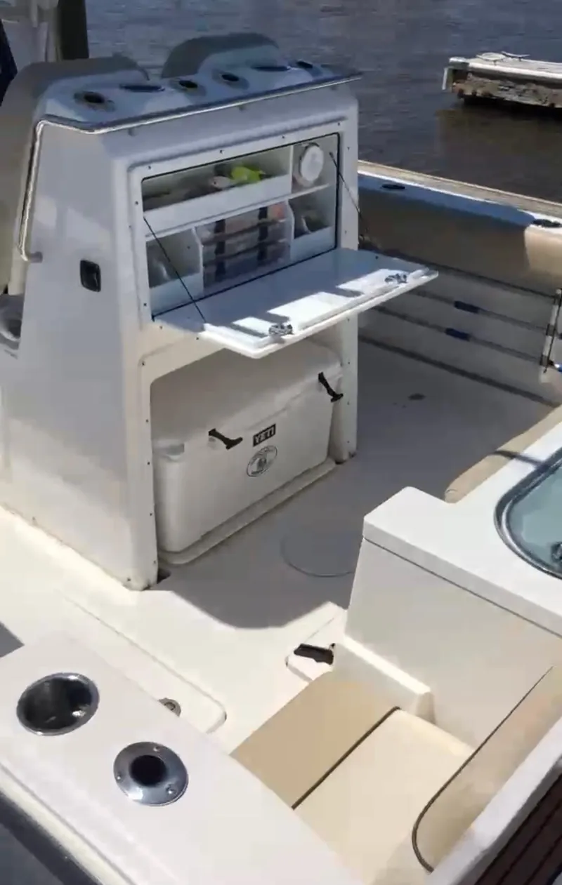 Slide: The Image of 2017 Sea Fox 288 Commander boat interior with seating and storage compartments. - 22