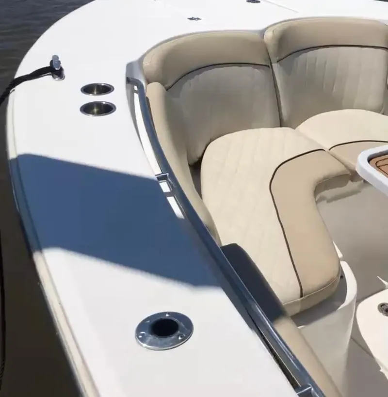 Slide: The Image of 2017 Sea Fox 288 Commander boat with cushioned seating and cup holders. - 26