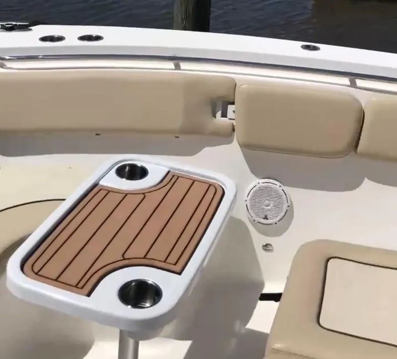 Slide: The Image of 2017 Sea Fox 288 Commander boat interior with cushioned seating and a wooden table. - 27