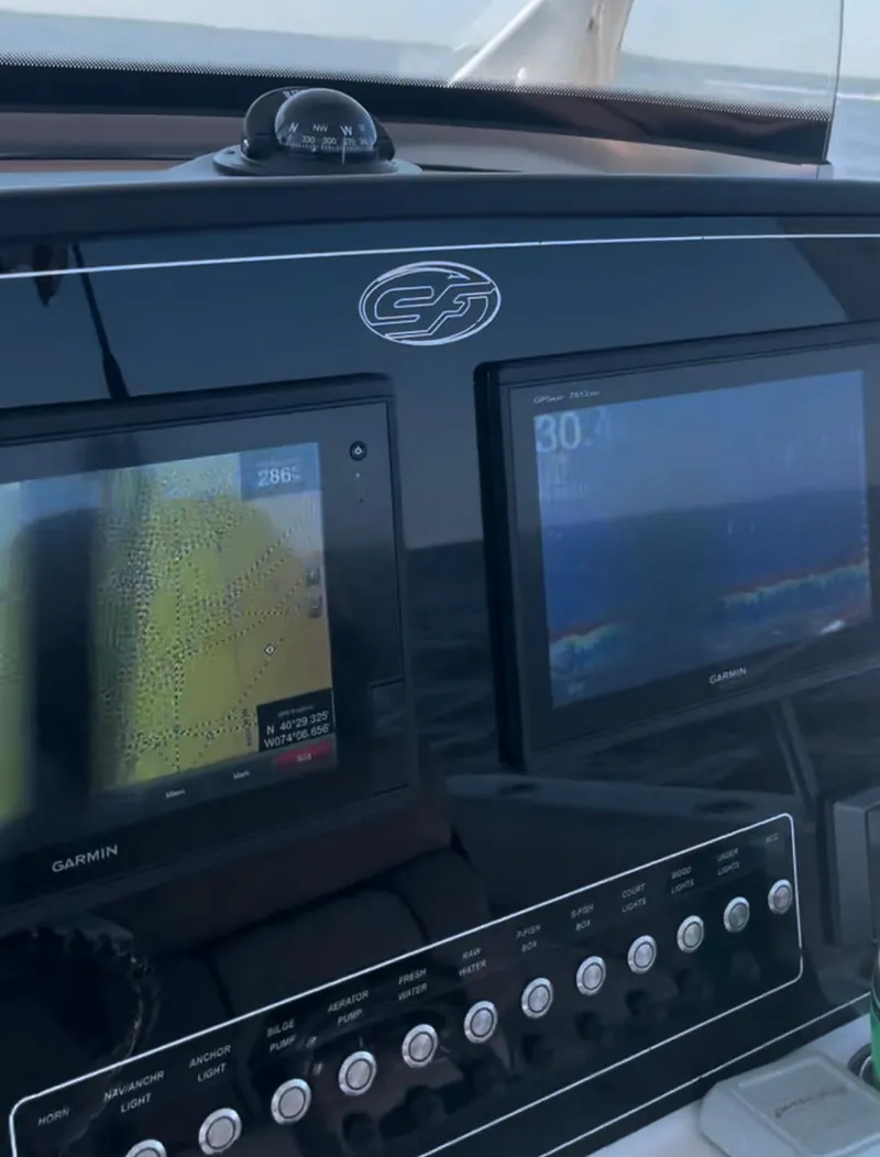 Slide: The Image of Control panel of a 2017 Sea Fox 288 Commander boat with Garmin displays. - 40